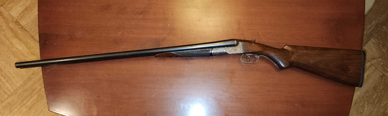 Left side full-length view of the restored Colt Model 1883 hammerless shotgun, serial number 2015