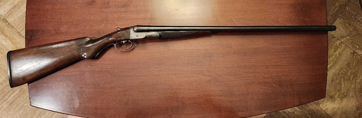 Right side full-length view of the restored Colt Model 1883 hammerless shotgun, serial number 2015