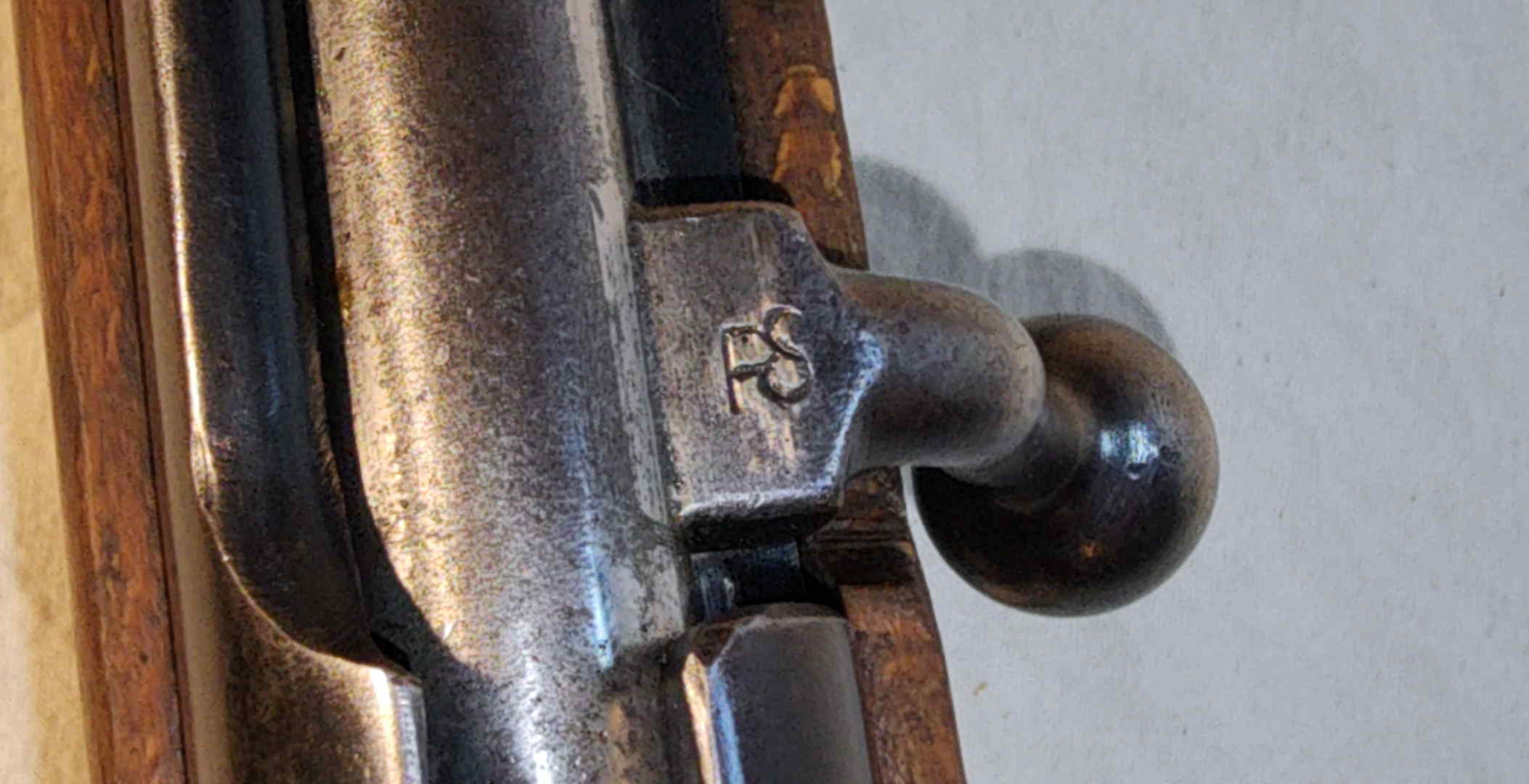 Bolt root and handle showing overlapping PS-type stamp