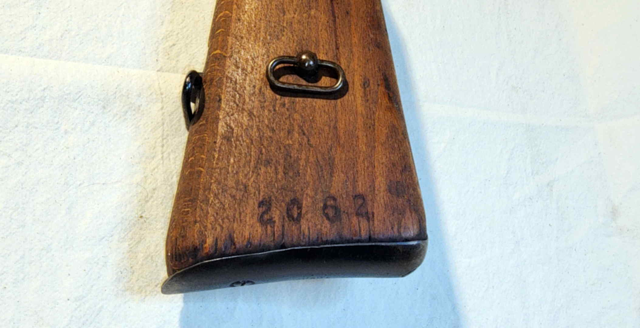 Buttstock stamped 2062 with side and bottom sling attachment points