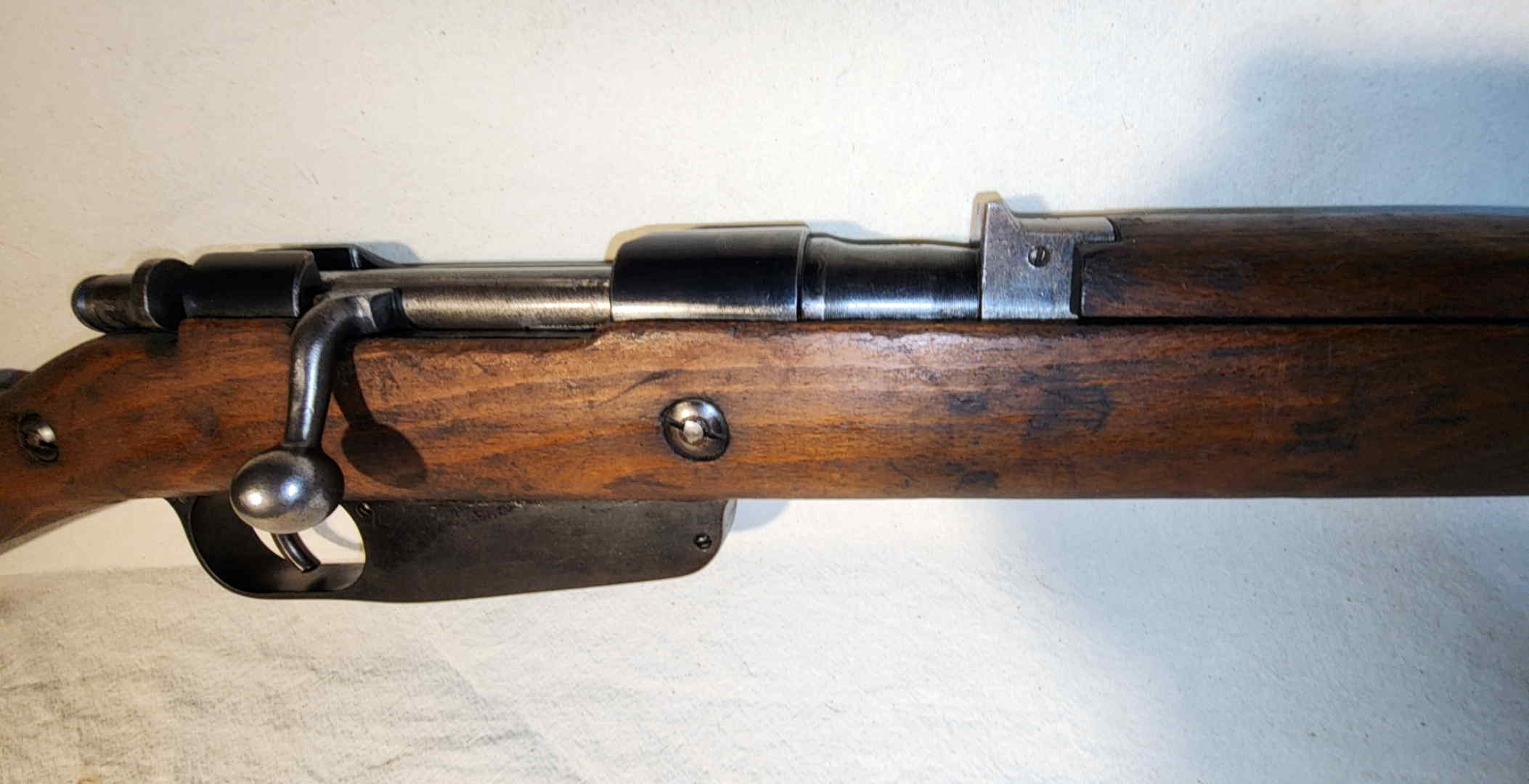 Action and stock detail showing Carcano bolt action and transverse stock reinforcement lug
