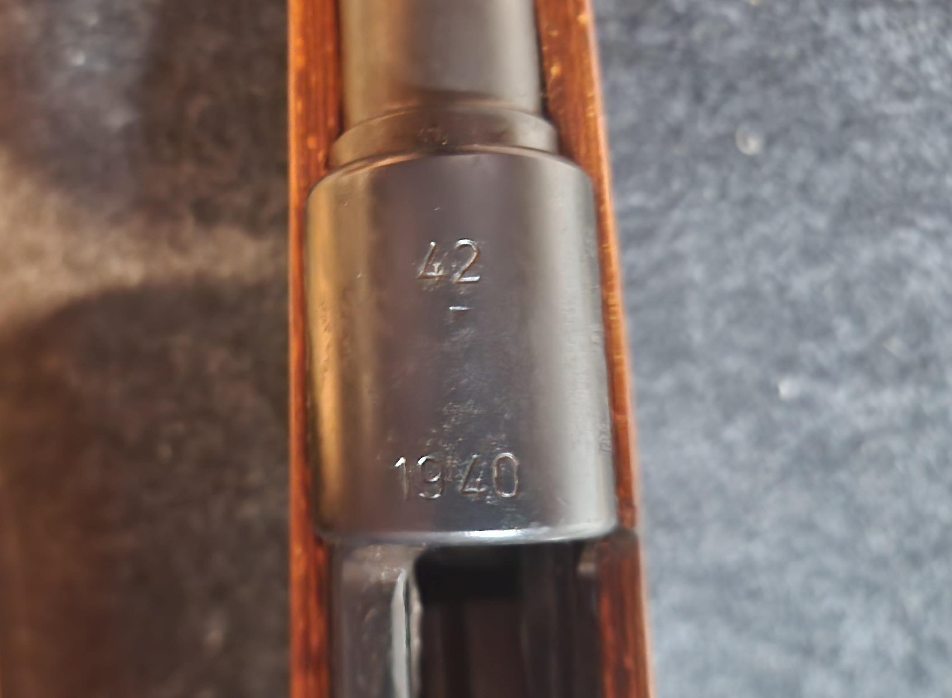 Receiver ring close-up stamped “42” over “1940”