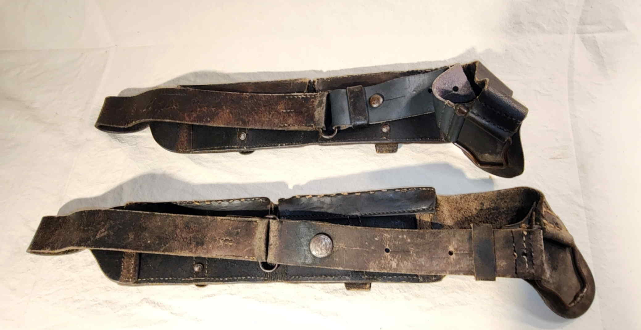 Reverse views of two Italian Modello 1897 M91 Carcano cavalry ammunition bandoliers