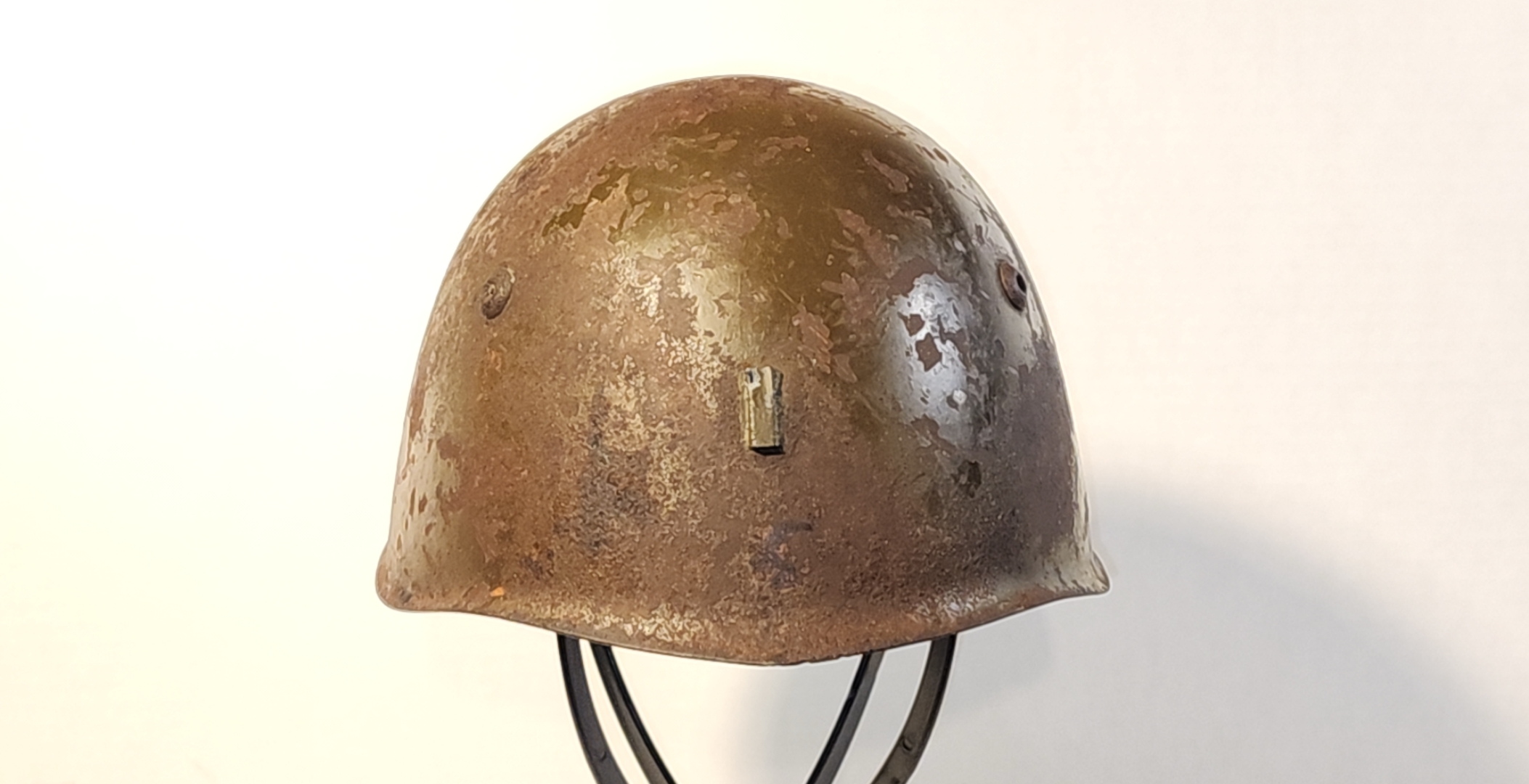 Front view of Italian M33 helmet with badge scar