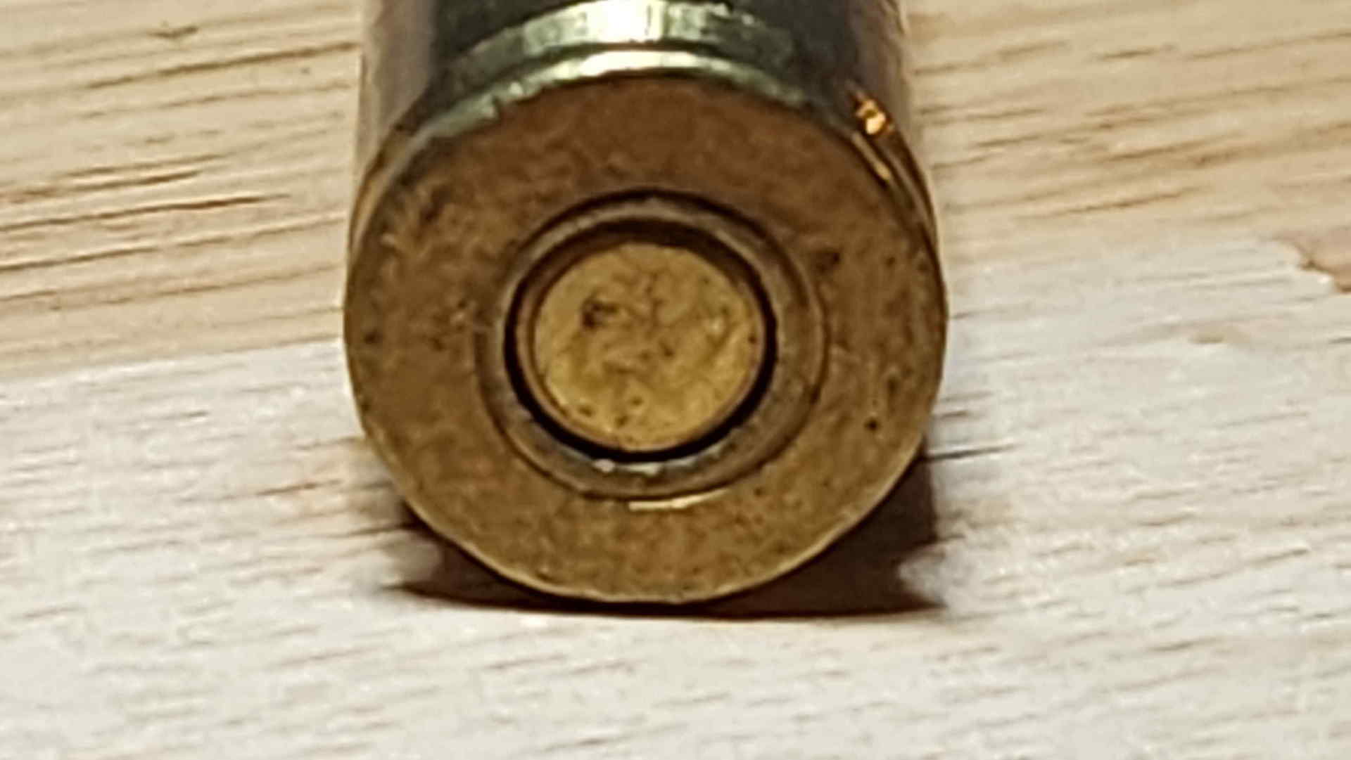 Blank headstamp base view of a 7.7×58mm Type 99 Arisaka cartridge