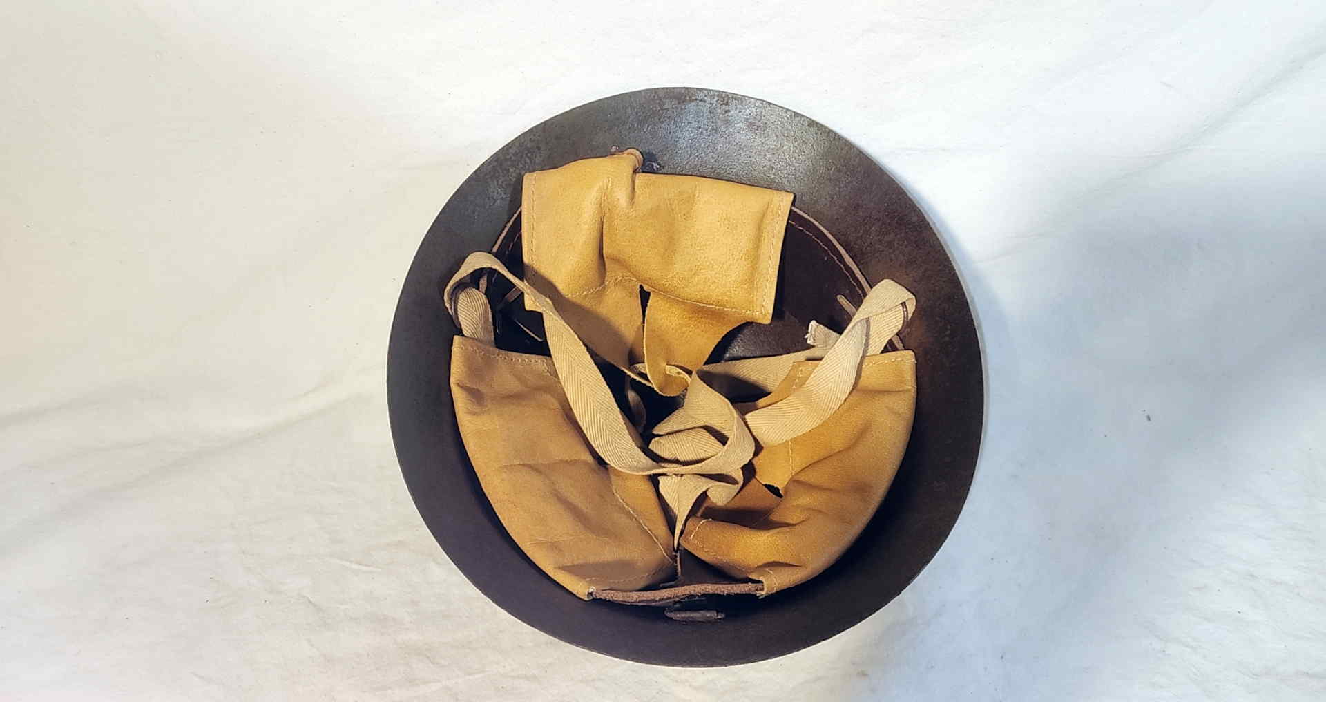 Interior bottom view of Japanese civilian home defense helmet with replacement leather liner