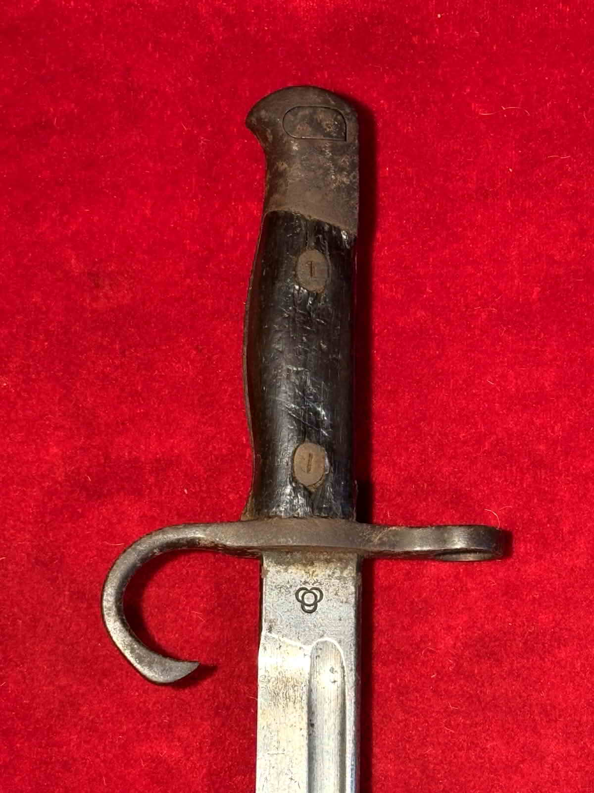Opposite hilt face of the Type 30 bayonet showing its hooked quillon and marked ricasso