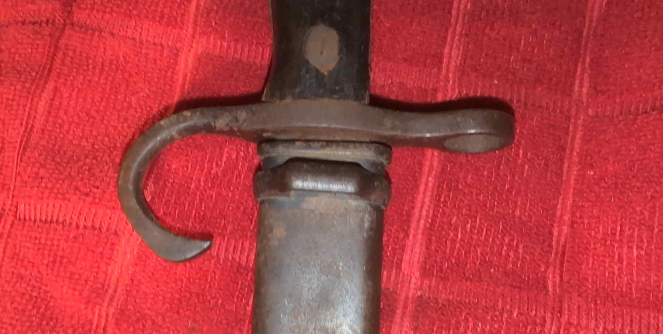 Opposite side of the Type 30 steel scabbard throat and frog stud