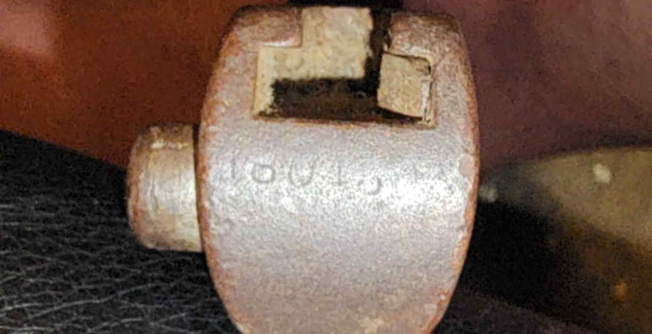 Birds-head pommel of the Type 30 bayonet with mounting mortise and faint serial number 16043