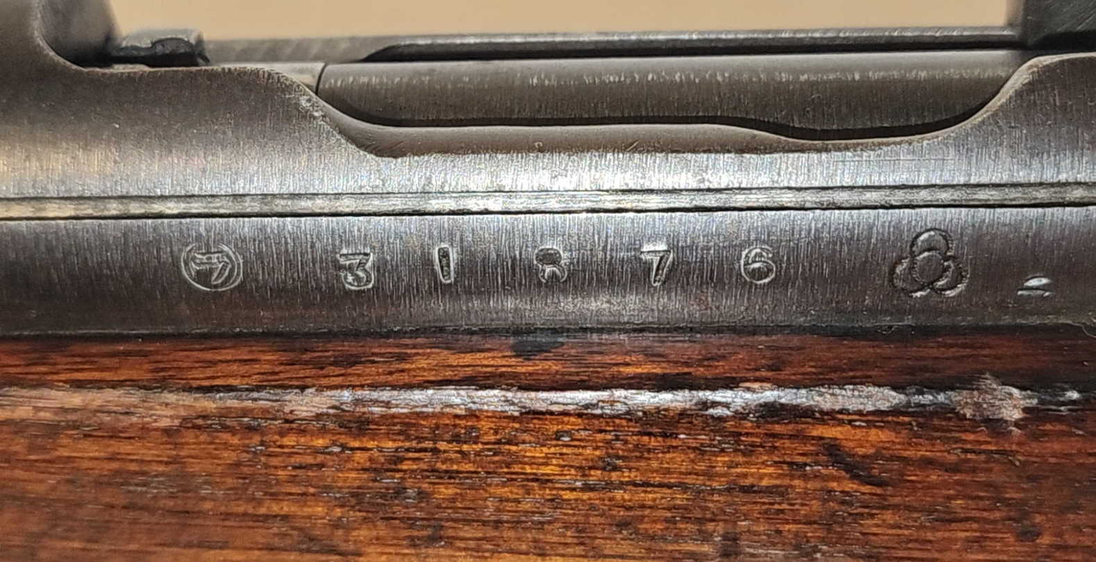 Arisaka Type 99 receiver markings showing series mark, serial number 31876, and Kokura Arsenal symbol