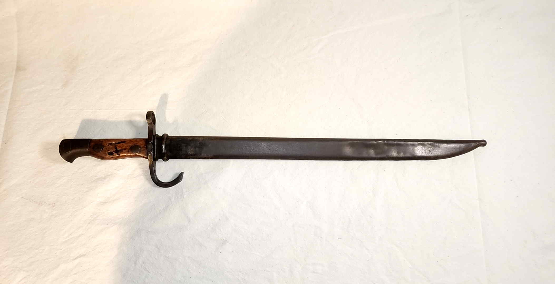 Japanese Type 30-pattern school bayonet fully seated in its steel scabbard