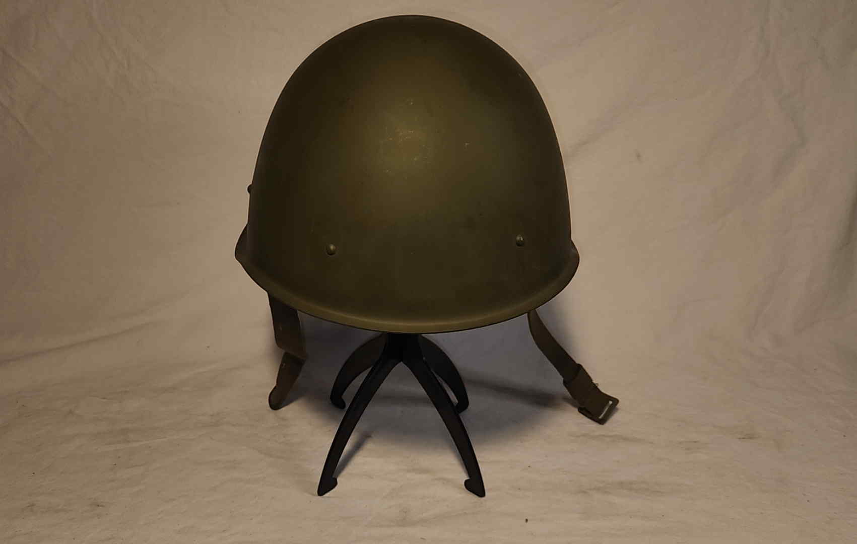 Overall rear view showing rolled rim and olive finish