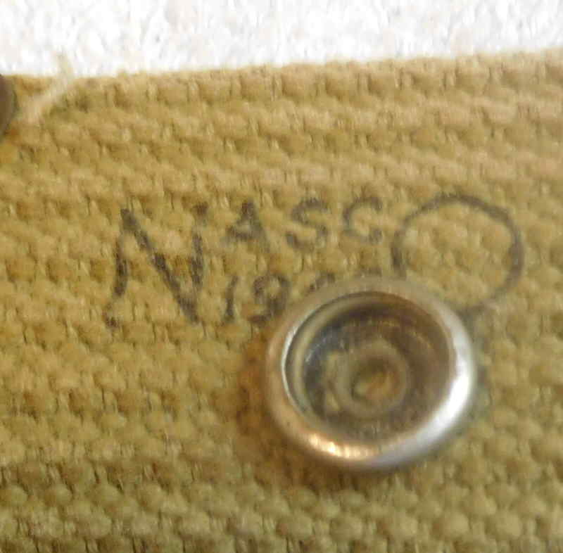Close-up of the NASCO 1942 maker and date stamp on the M-1936 pistol belt