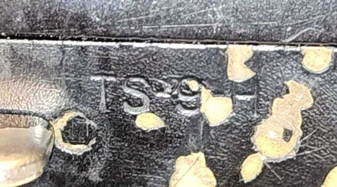 Close-up of the TS-9-H stamp on the handset handle