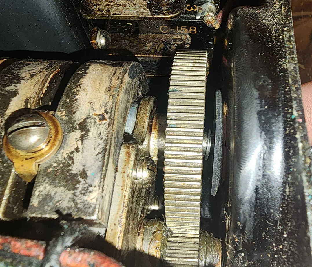 Close-up of EE-8-A hand-crank magneto clutch and gear surfaces after degreasing to restore engagement