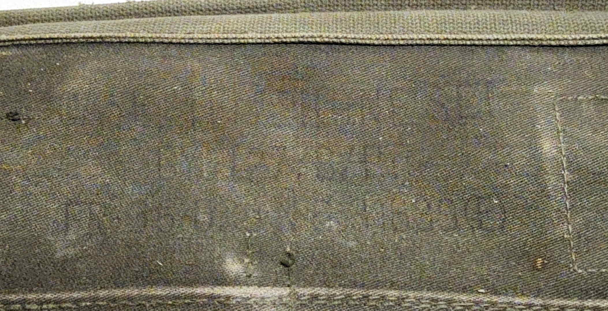 Faded contract stencil on the front of the TA-312/PT carrying case