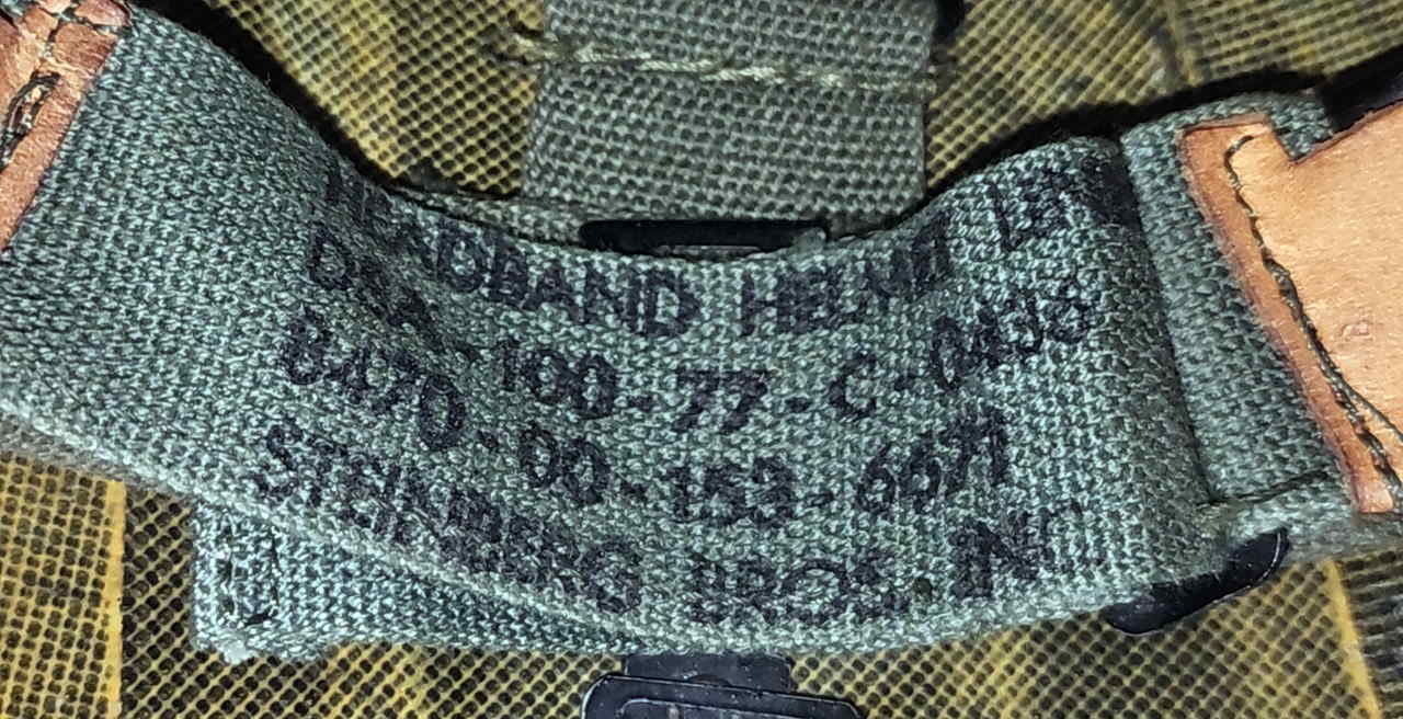 Headband marking showing DSA-100-77-C-0438 and Steinburg Bros Inc