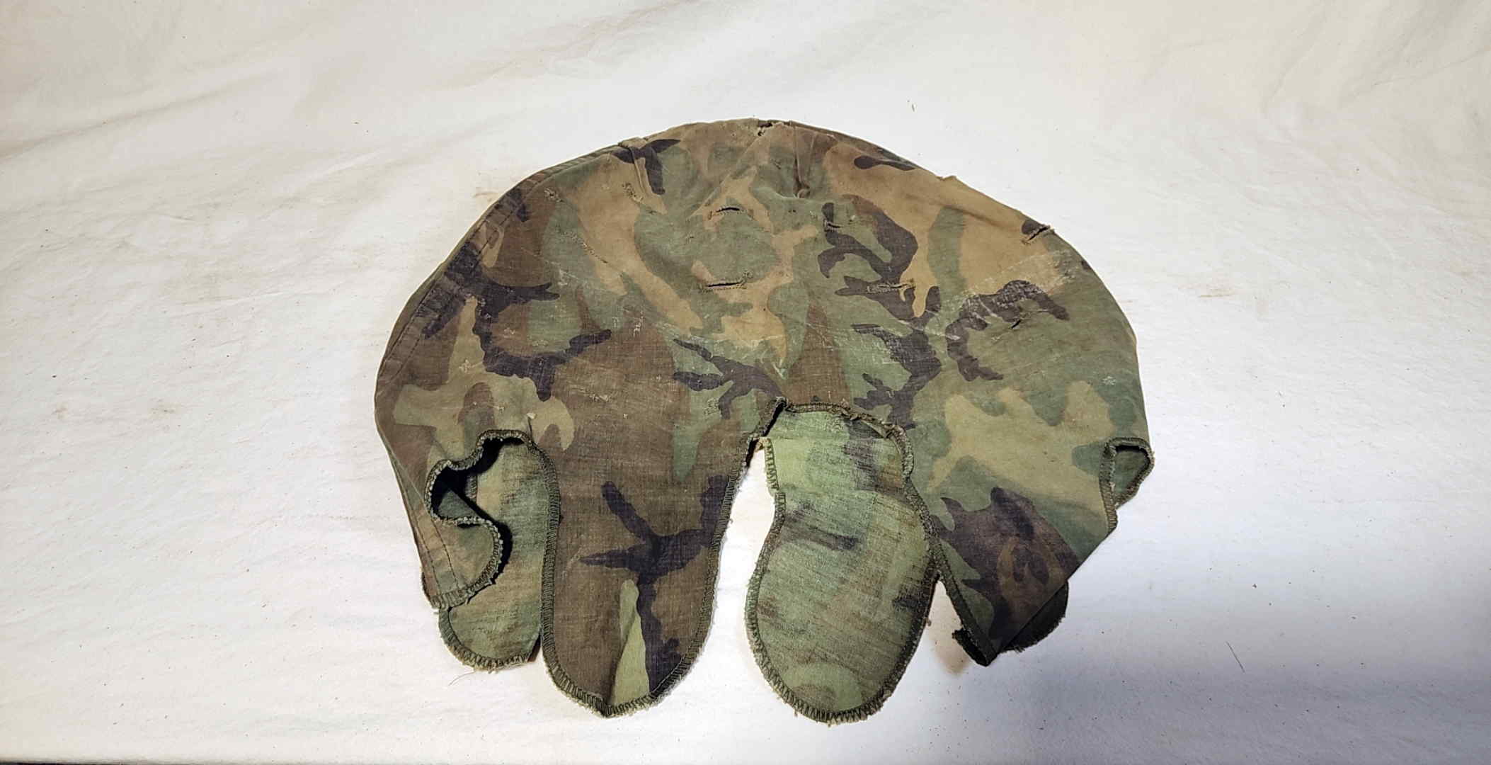 ERDL camouflage helmet cover fitted to helmet