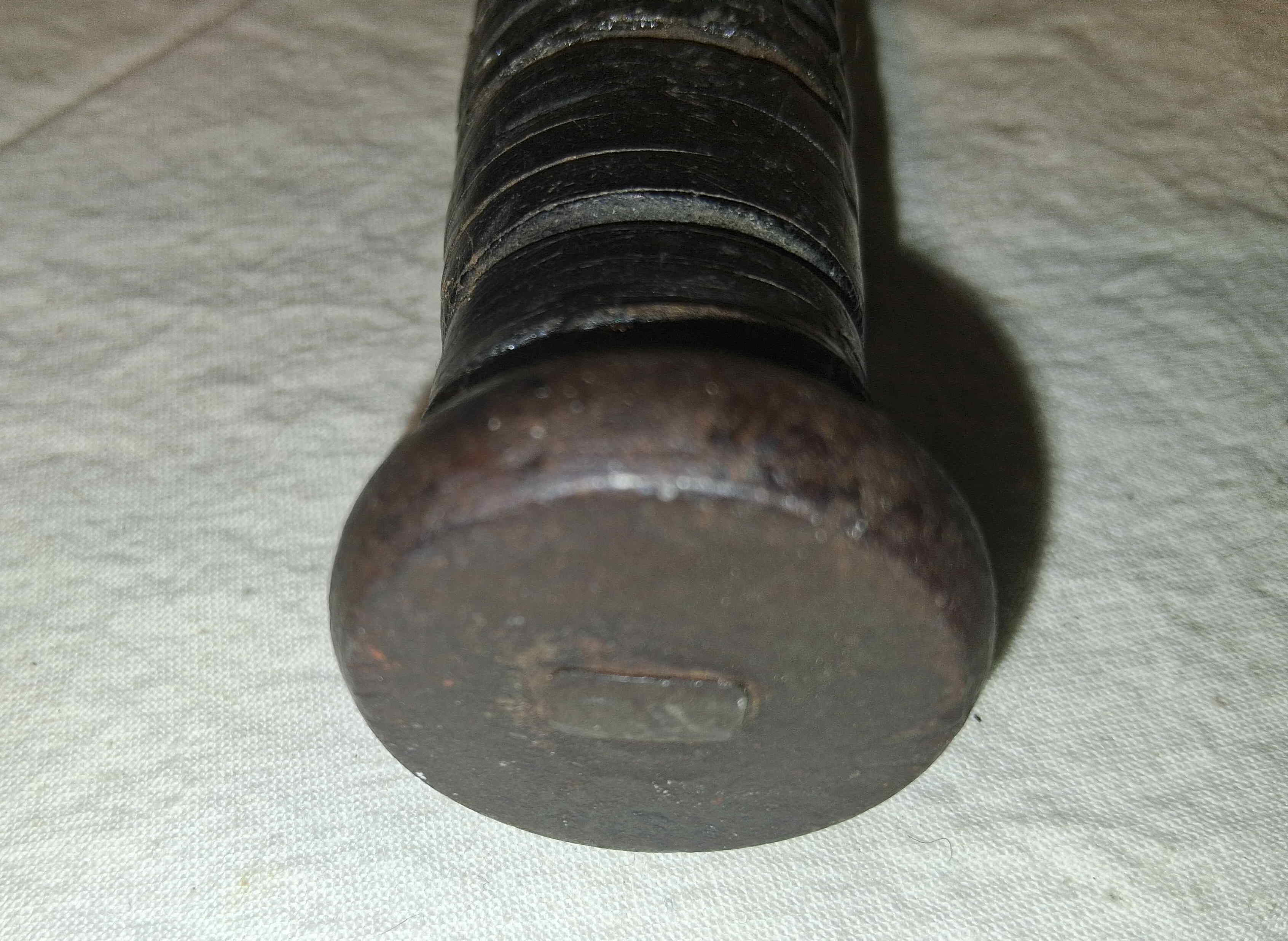 Heavy steel pommel of the KA-BAR U.S. Navy Mark 2 knife showing the peened rectangular tang
