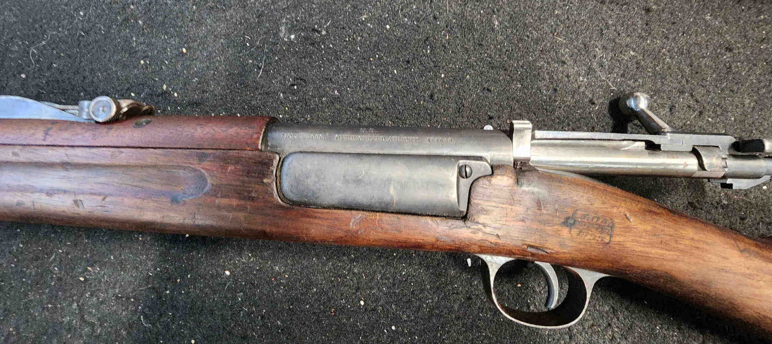 Close view of receiver markings and action area on Krag rifle